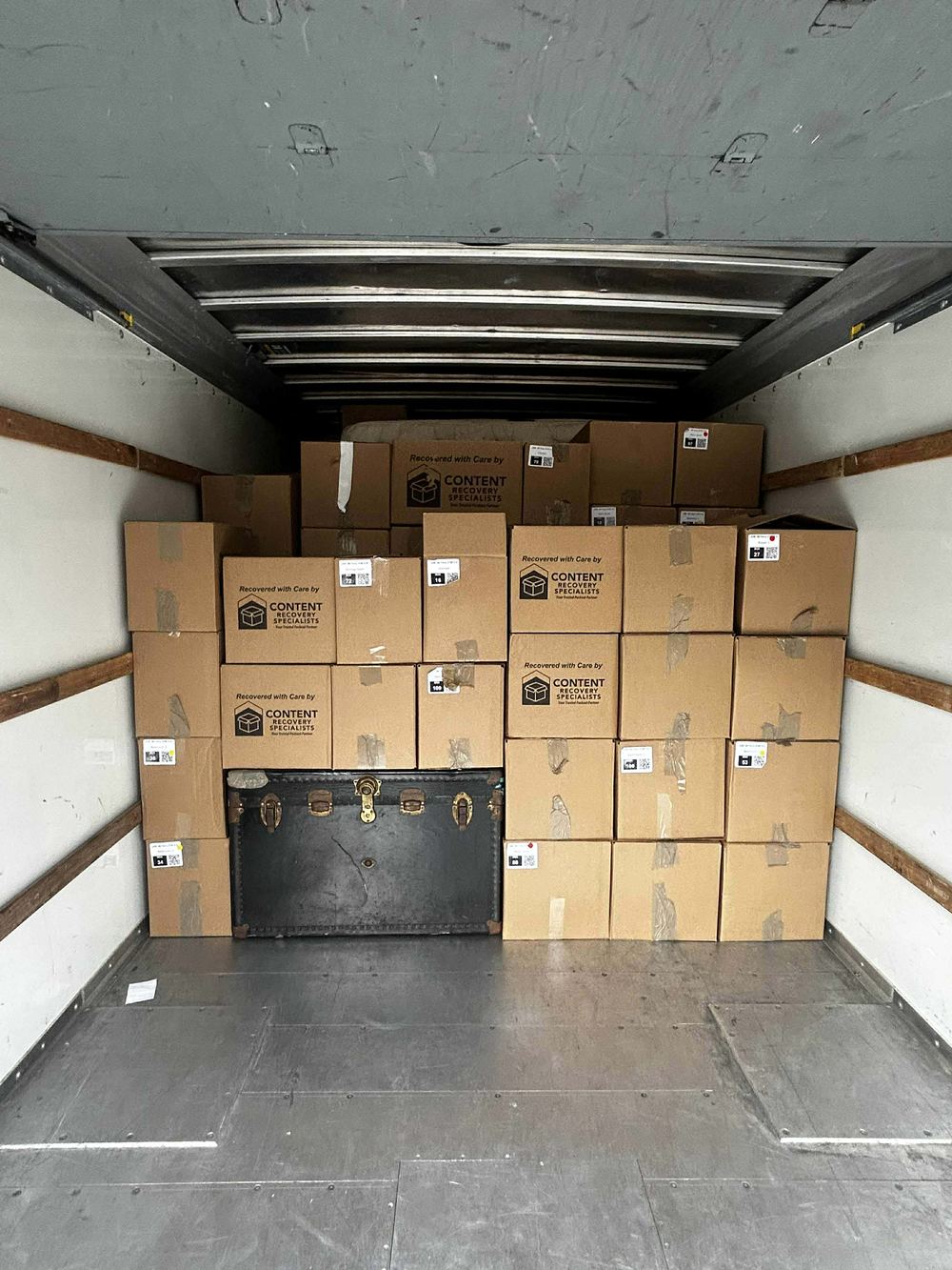 Moving boxes stacked square and tight to the ceiling by the Citi Haulers crew in a Tulsa moving truck